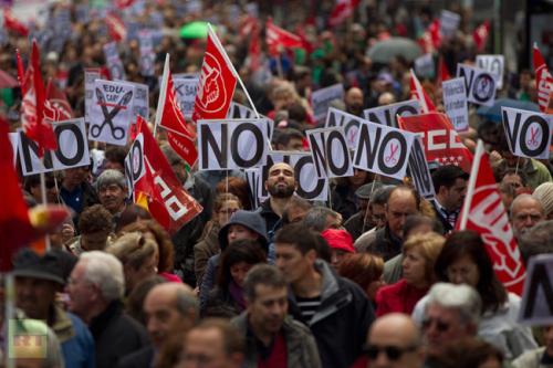 demonstrators-hold-signs-read demonstrators-hold-signs-read