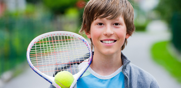 boy-playing-tennis