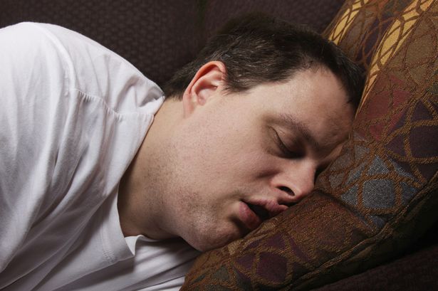 Man-sleeping-on-couch