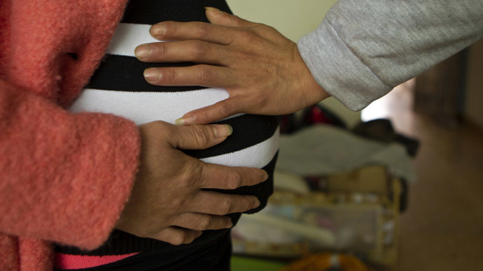 french-surgeons-fetus-operation.si