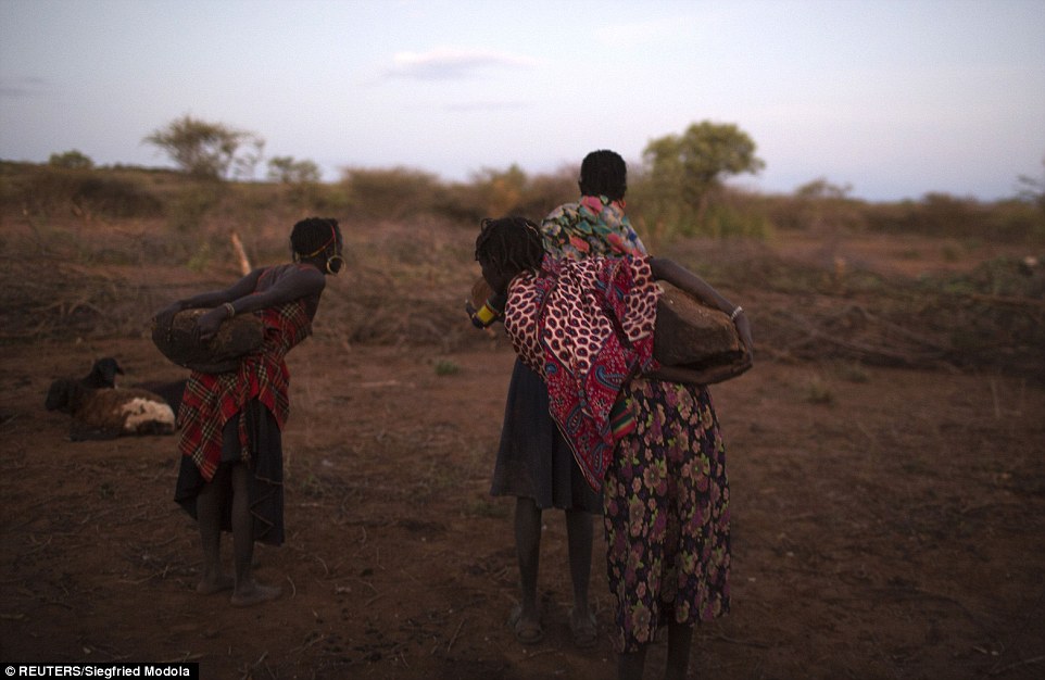 1415872907446_wps_87_Pokot_women_place_stones_