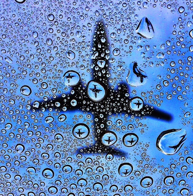 Cool-Photo-of-a-Plane-Passing-Behind-Window-Condensation
