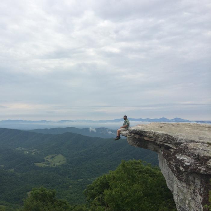 Crazy-Man-Sitting-on-a-Cliff-in-Appalachian-mountains