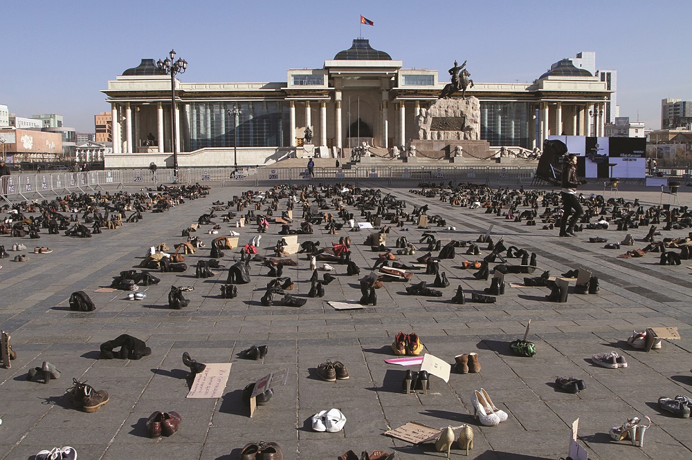 Thousands of empty shoes stand in for protesters