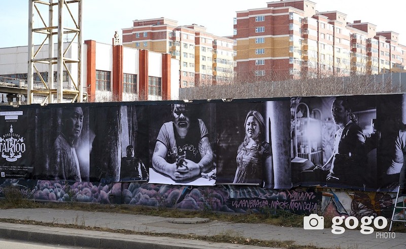 Tattoo artist portraits displayed as public art